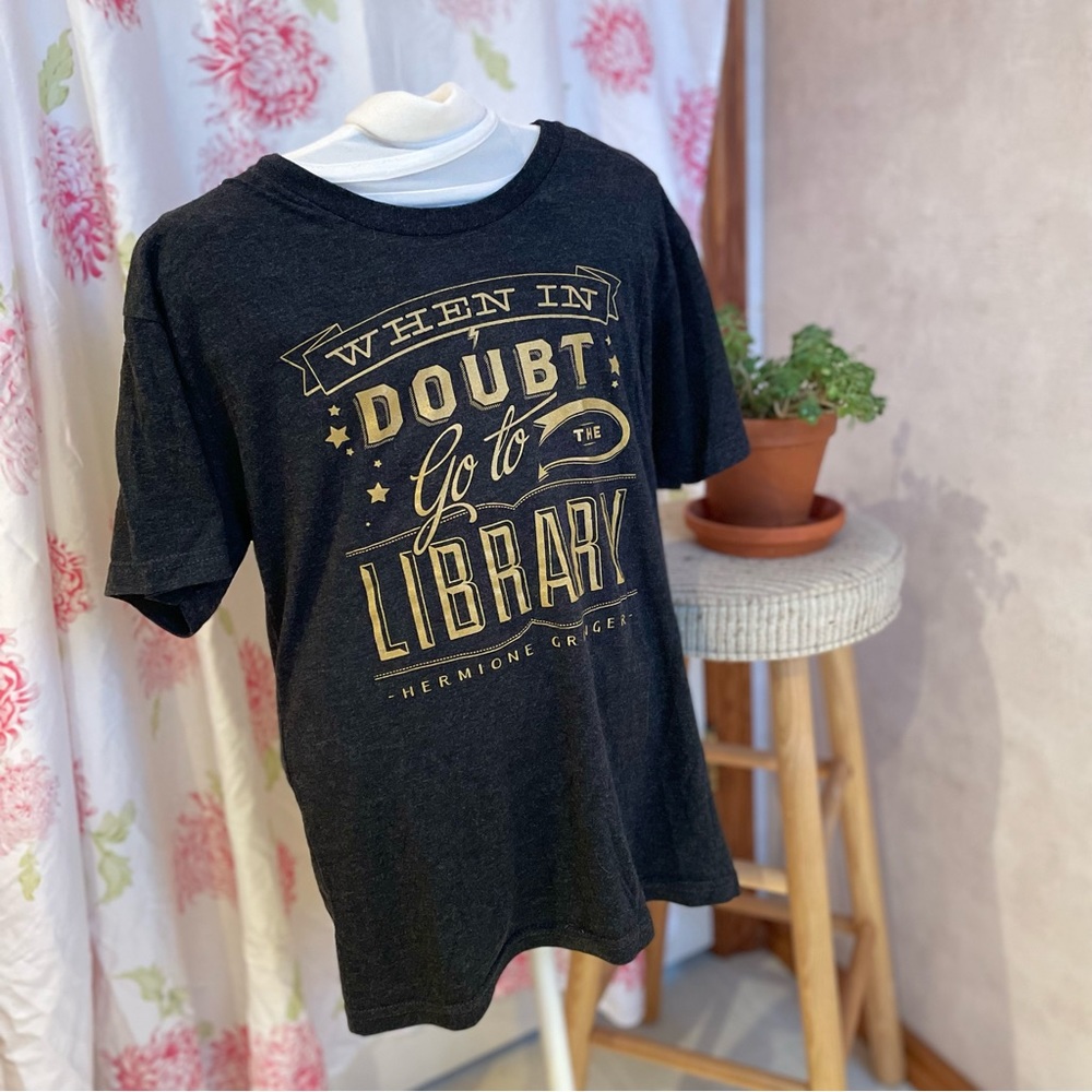 Hermione Granger quote tee in charcoal grey with gold graphics